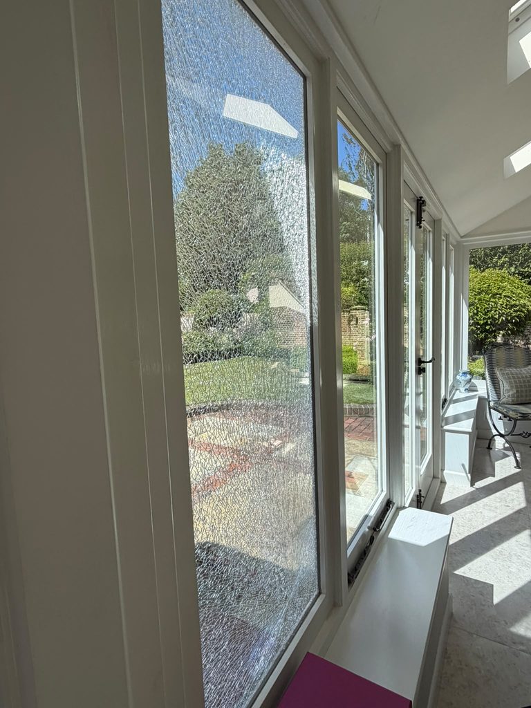 Damaged glass at Blackwater Medical Centre in Maldon before repair